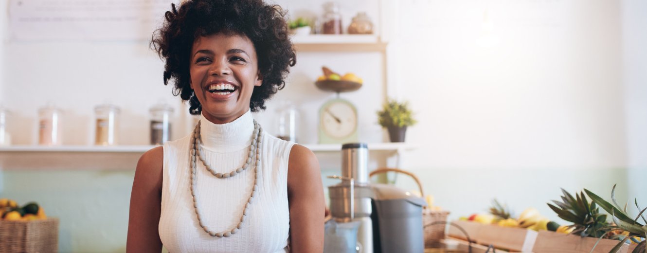 A smiling young woman working at a small business